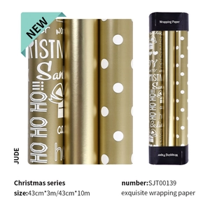 Gold Christmas wrapping paper roll set with polka dots and festive holiday lettering