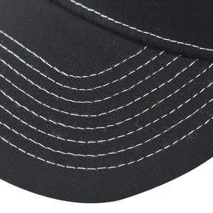 Detailed close-up of a black baseball cap brim with white six-row contrast stitching