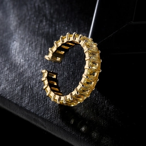 Adjustable gold plated ring featuring baguette cut yellow zircon in a geometric open design