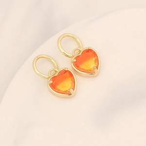 Chic 18K gold plated heart earrings with orange gradient crystals on white background