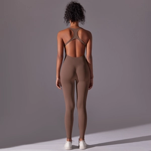 Back view of brown seamless yoga jumpsuit featuring a cross-back strap design and high elasticity