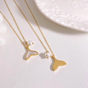 Golden mermaid tail necklace set with freshwater pearls and seashell inlay pendants