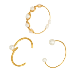 Three gold-plated open bangles featuring freshwater pearls in various luxury styles