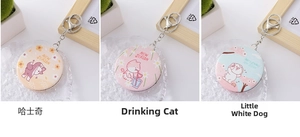 Detail of round PU leather folding makeup mirror keychains with cute animal patterns