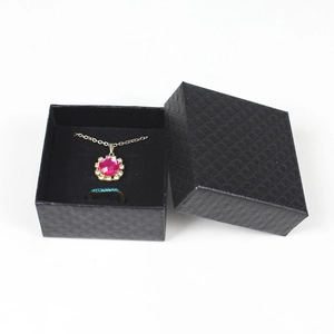 Elegant black textured jewelry gift box set with necklace and gemstone ring
