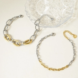 Detailed shot of mixed-metal stainless steel link chains with gold and silver finish