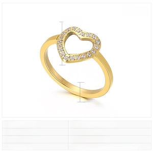 Close-up of golden hollow heart ring with sparkling zircons on polished stainless steel band