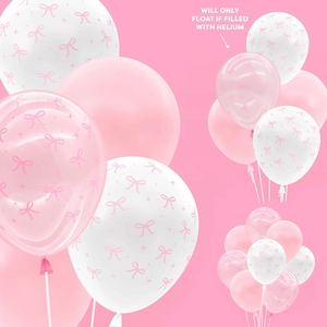 Close-up of pink, white, and bow-printed balloons for sweet party decorations