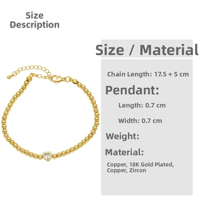 Detail view of 18K gold plated beaded bracelet with heart pendant and zirconia stone