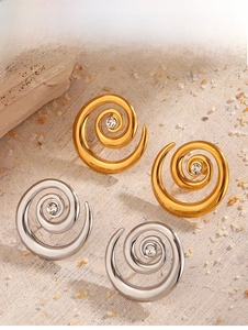 Detailed view of spiral swirl stud earrings with clear crystal centers in gold and silver