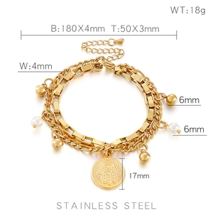 Detailed view of a gold stainless steel double-layered bracelet with Hamsa Hand pendant