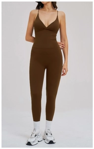 Front view of a brown high-waisted yoga set with a V-neck vest and leggings on model