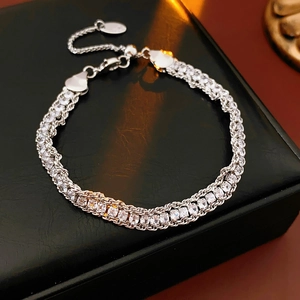 Macro shot of silver adjustable chain bracelet with sparkling square-cut zircon stones