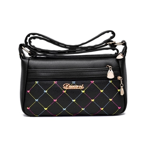 Women's black faux leather shoulder bag with colorful diamond stitching and gold hardware