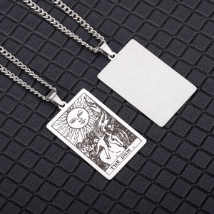 Vintage stainless steel Tarot Sun pendant necklace for men and women on black background