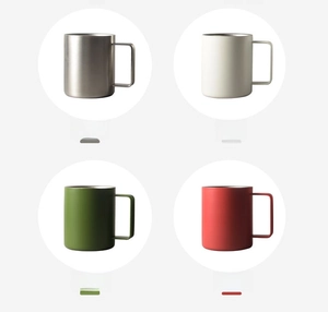 Detail view showing four minimalist stainless steel mugs in silver, white, green, and red