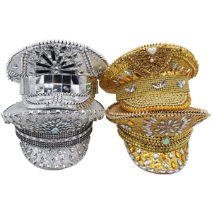 Close-up of gold and silver military hats with colorful sequins and heart gems