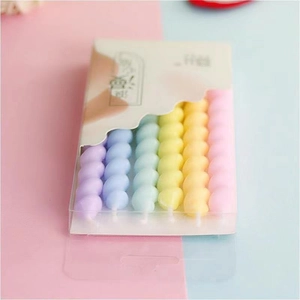 Colorful spiral birthday candles set in transparent box packaging