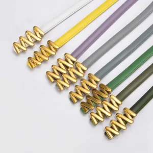 Slim leather belts for women in multiple colors with stylish wavy gold metal buckles