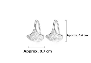 Macro detail of S999 sterling silver ginkgo leaf earrings with fine vein texture