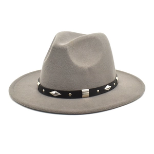 Close-up of grey felt fedora featuring a black band with silver diamond metal studs