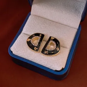 Luxury D-shaped gold earrings with black enamel inlay and zircon accents for women