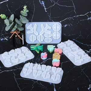 DIY silicone resin mold set featuring airplane and heart shapes on marble background