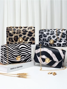 Mini leopard print chain bags with vintage animal patterns and gold metal lock closures