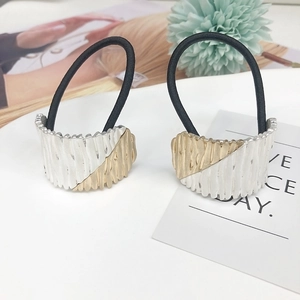 Minimalist alloy arched hair ties set with gold and silver striped metallic textures