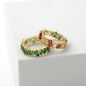 Stack of 18K gold plated rings with green and colorful baguette cut zircon stones
