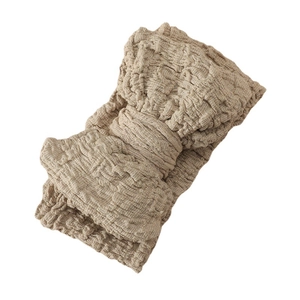 Oversized khaki textured bow headband for babies made of high-stretch crepe fabric