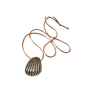 Elegant silver shell pendant necklace with textured seashell design on brown cord