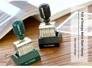 Detail view of vintage wooden date roller stamps with adjustable rubber wheels
