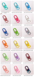 Macro detail of various colorful metal swivel lobster clasps for DIY jewelry making