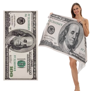 Detailed macro view of the microfiber beach towel featuring a creative 100 dollar bill print