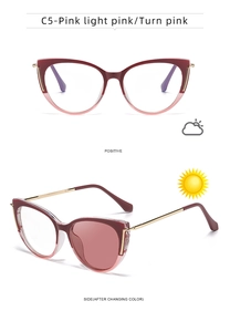 Cat eye sunglasses detail showing pink gradient frame and gold metal temples in detail