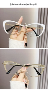 Detail showing white gold and pure gold cat-eye metal frames with sleek retro temples