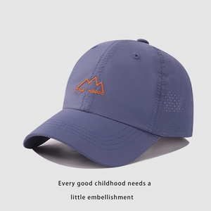 Detail of grey-blue kids baseball cap with mesh side panels and mountain embroidery