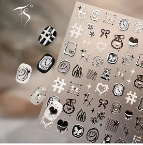 Macro detail of 3D embossed nail stickers featuring silver clocks, hearts and stars