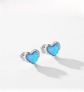Detail view of heart-shaped S925 silver stud earrings with blue opal and small zircons