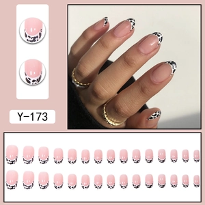 French cow print press-on nails with nude pink base and black white cow spots style Y-173