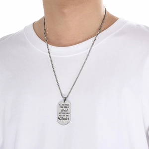Close-up of silver stainless steel dog tag necklace for Dad on a male model