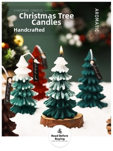 Detailed view of handmade Christmas tree scented candle with snowy texture and festive setup