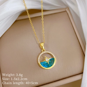 Macro detail of starburst necklace pendant with blue crystal and size dimensions