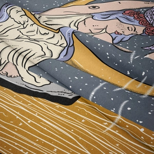 Close-up of fine woven fabric texture on a mystical celestial tarot tapestry