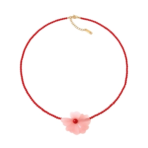 Stainless steel beaded necklace with red stones and pink translucent flower pendant