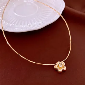 Gold plated flower necklace with zircon pendant on sleek snake chain for women