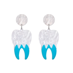 Detailed view of acrylic fang earrings in white and blue for Halloween costumes