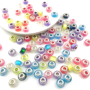 Macro shot of assorted colorful glass beads with metal cores for DIY charm bracelets