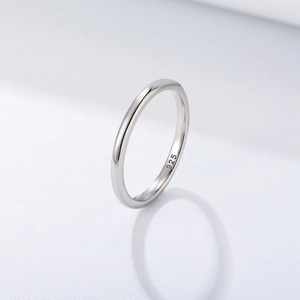 Minimalist 925 sterling silver ring with a polished glossy finish on a white background